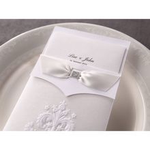 Traditional white embossed wedding invitation in rectangle featuring embossed pocket and white ribbon